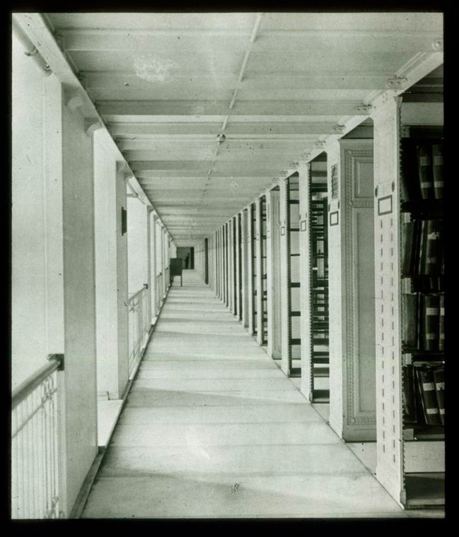 large room showing rows and rows of book cases