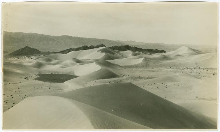 a barren desert with peaks of sant