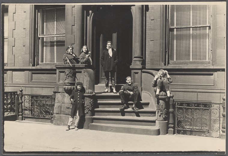Six girls on a brownstone stoop.