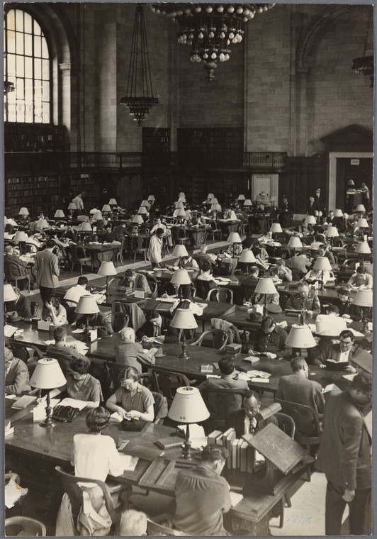 researchers at long tables in Library's main reading room