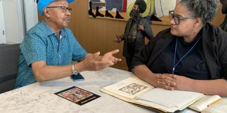 Photograph of Michael A. Cummings and Tammi Lawson, Curator of Art & Artifacts Division, Schomburg Center for Research in Black Culture 