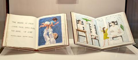 Exhibition featuring two colorful, illustrated Seder books. 